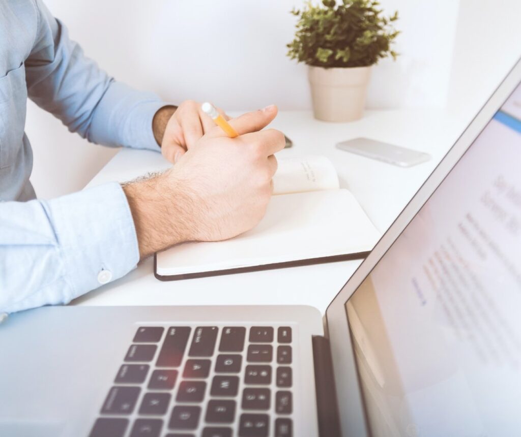 front page image man sitting at laptop 2